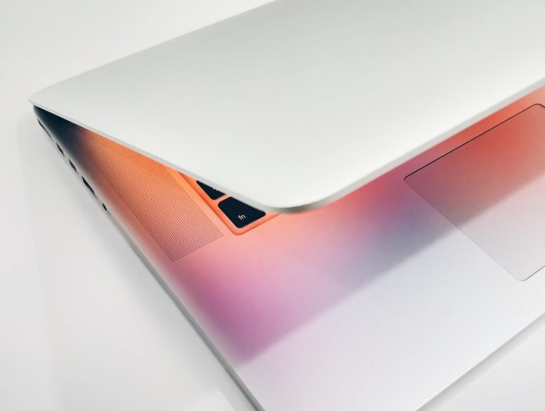 Slightly open laptop with glowing screen