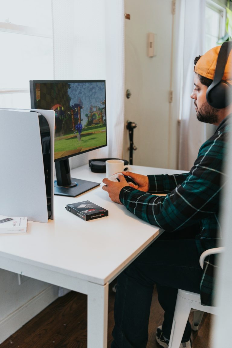 Man playing a game wearing headphones.