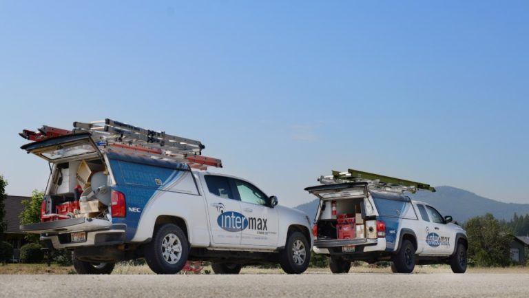 Two Intermax Networks trucks in the field.