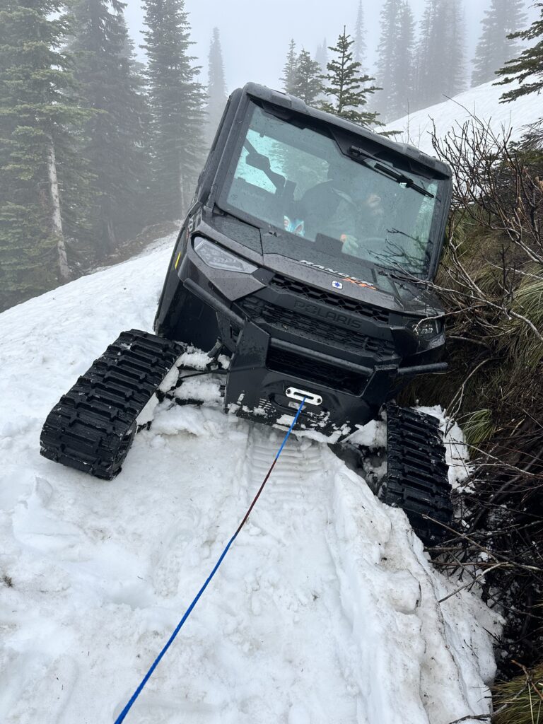 Intermax techs recovering vehicle stuck in the snow.