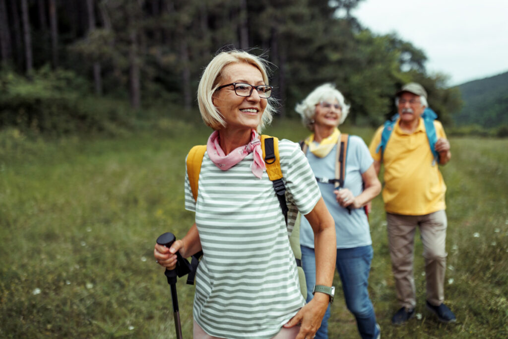 Mature women hiking with her friends.