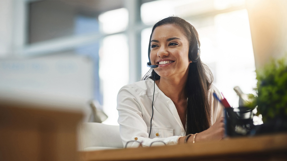 Female employee on a headset.
