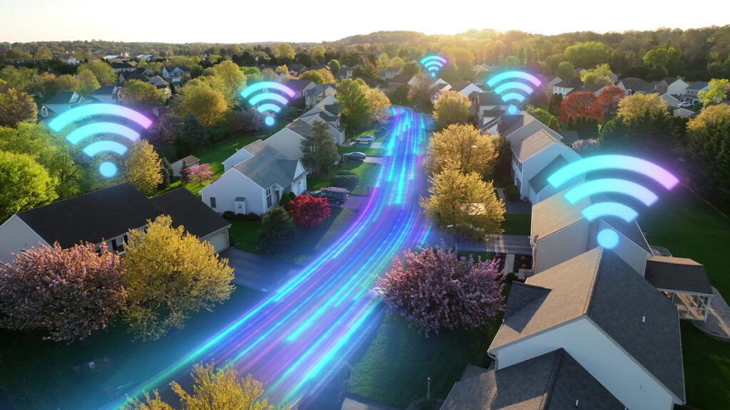 Blue fiber lines running down a residential street and wifi signals above the homes.