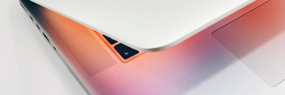 Slightly open laptop with glowing screen