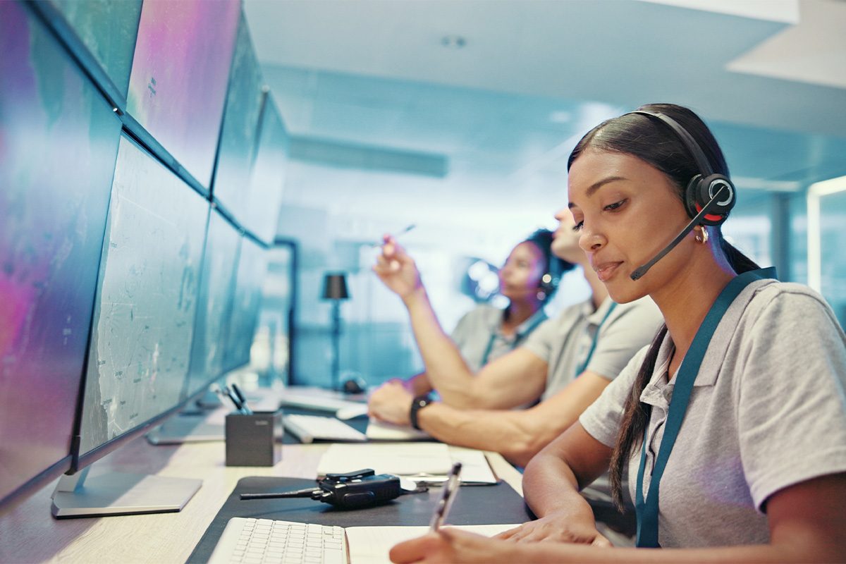 Emergency services dispatcher with headset.