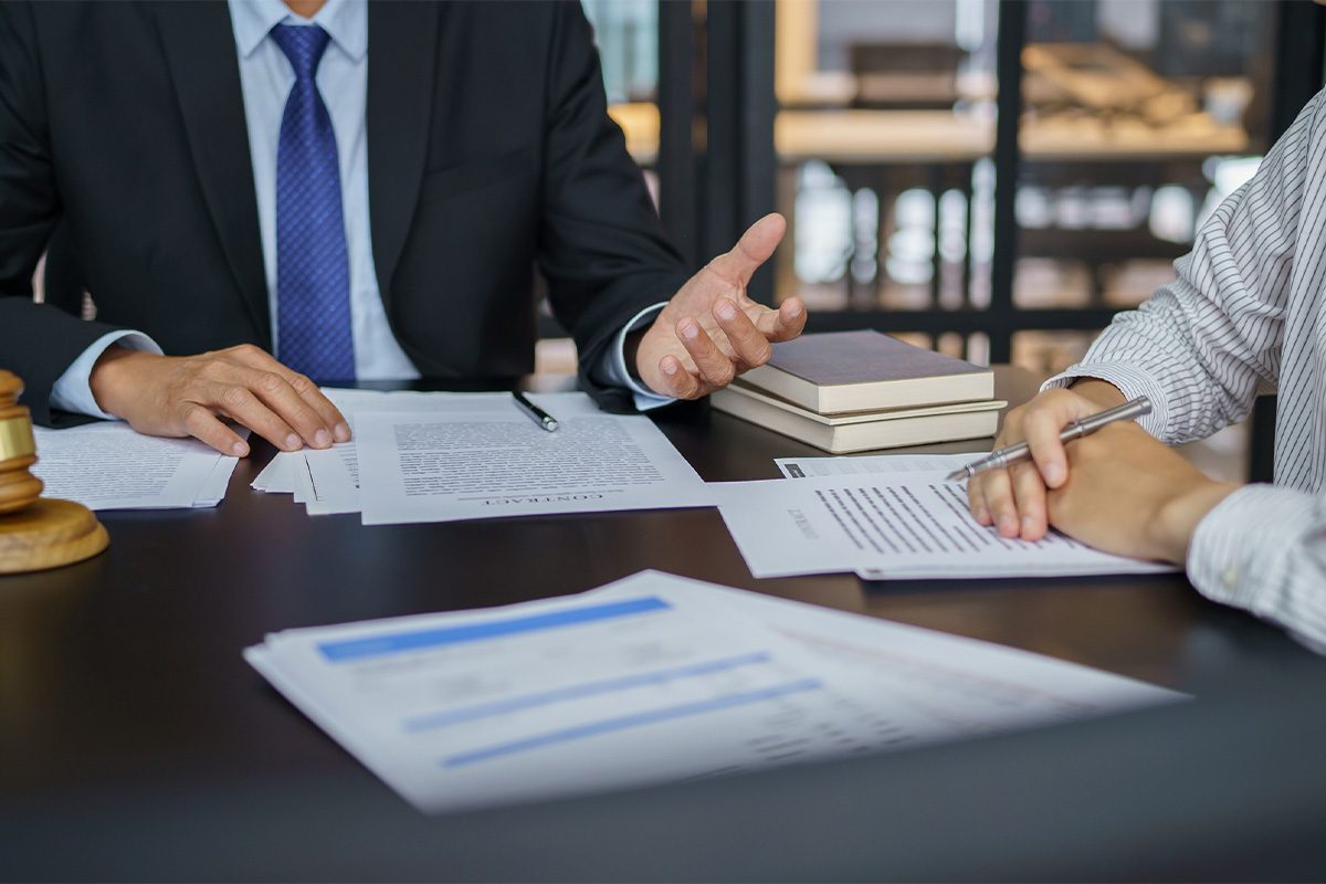 Legal counsel presents to the client a signed contract.