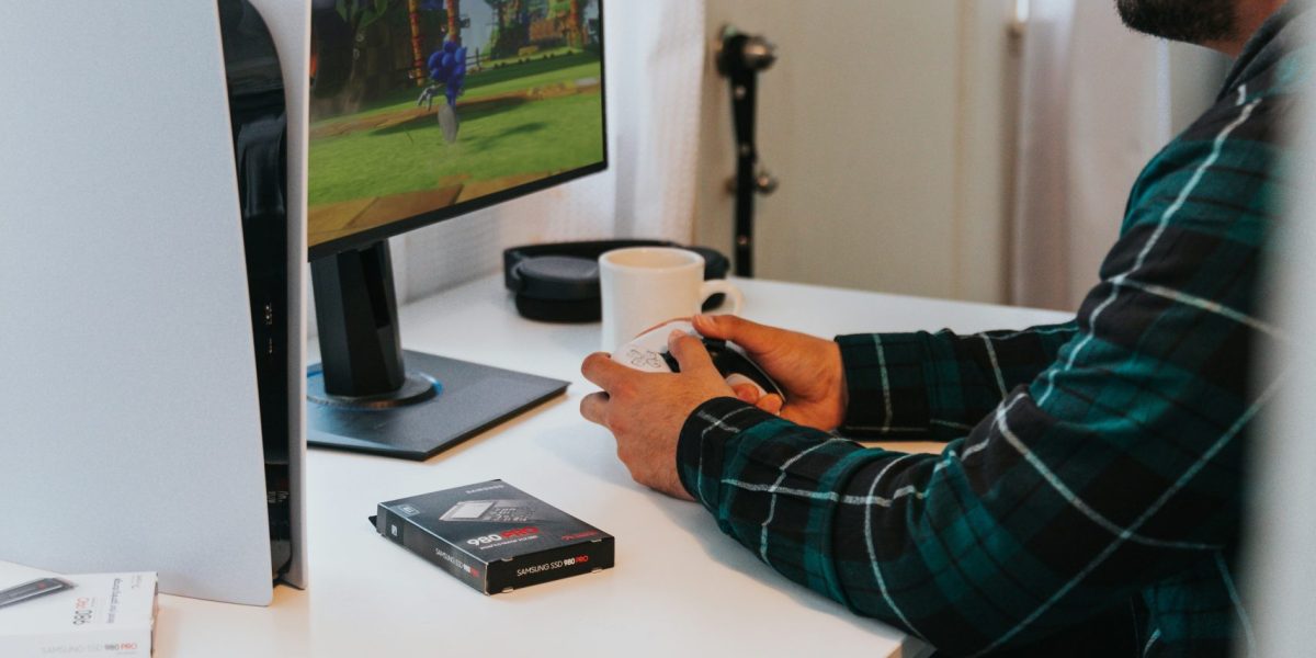 Man playing a game wearing headphones.