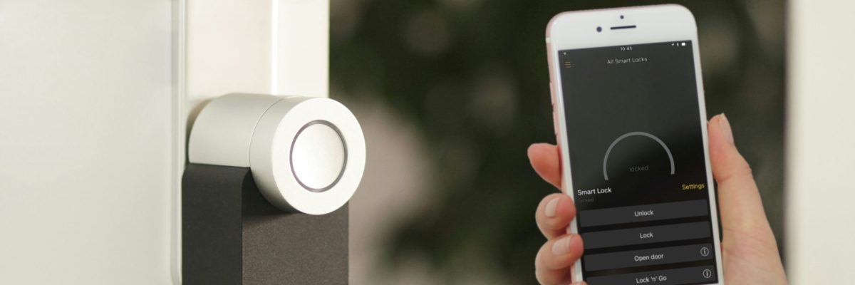Phone held next to door with Ai smart locks